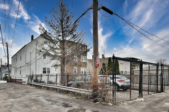 view of home's exterior featuring fence