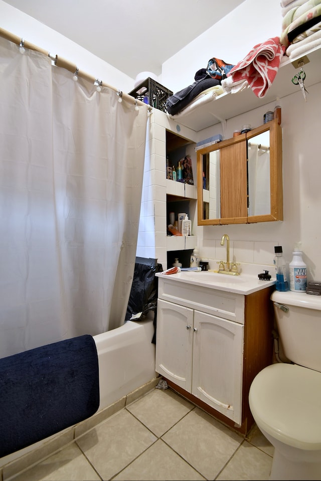 bathroom with shower / bath combination with curtain, toilet, tile patterned flooring, and vanity