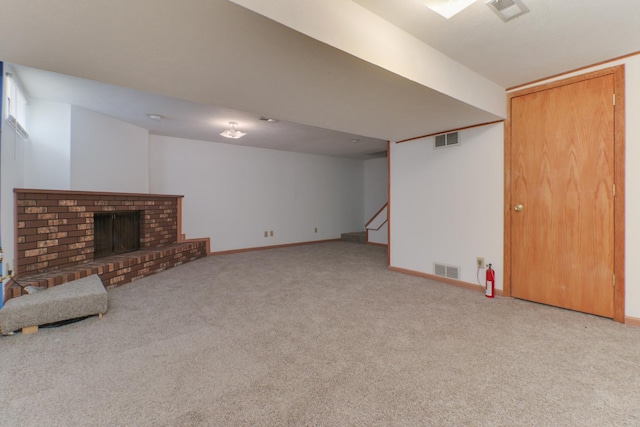 unfurnished living room with baseboards, carpet flooring, and visible vents