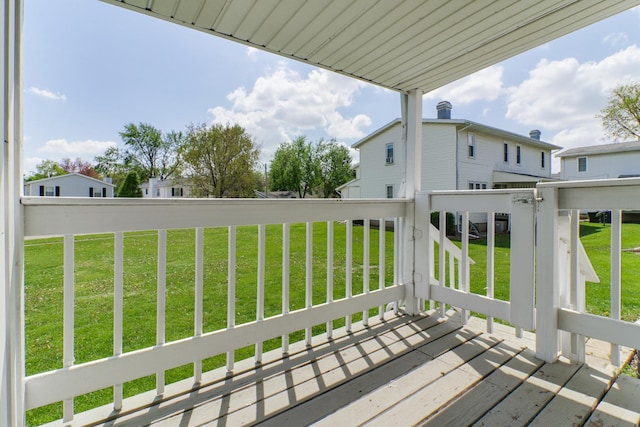 wooden deck featuring a yard