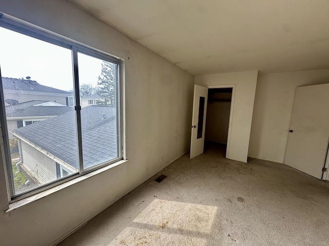 unfurnished bedroom with visible vents