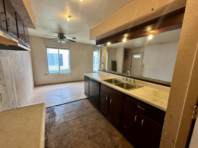 kitchen with black dishwasher, a sink, light countertops, a ceiling fan, and dark brown cabinetry