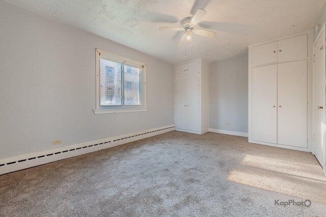 2051 E 72nd St Unit 1B, Chicago, IL 60649 - spare room with a baseboard heating unit and light wood finished floors