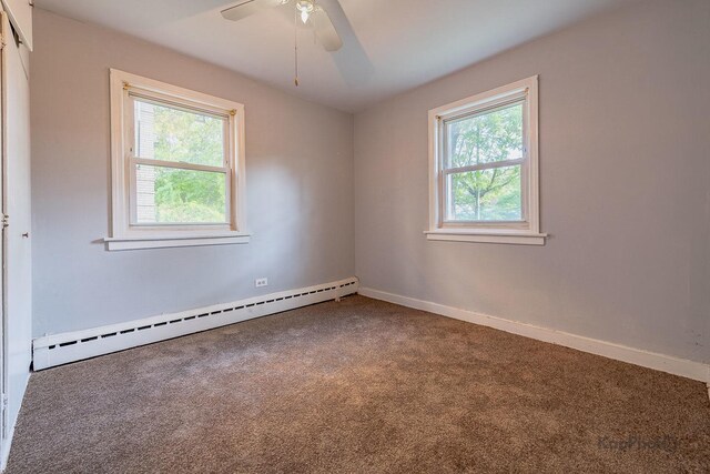 2051 E 72nd St Unit 1B, Chicago, IL 60649 - empty room with baseboard heating, a ceiling fan, and light wood finished floors