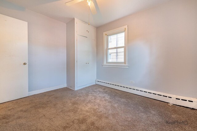 2051 E 72nd St Unit 1B, Chicago, IL 60649 - empty room with baseboard heating, light wood-style flooring, and ceiling fan