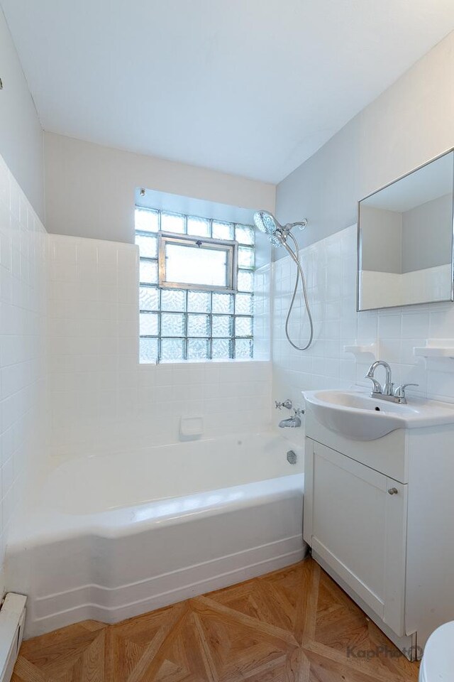 2051 E 72nd St Unit 1B, Chicago, IL 60649 - carpeted spare room featuring a baseboard radiator and a ceiling fan