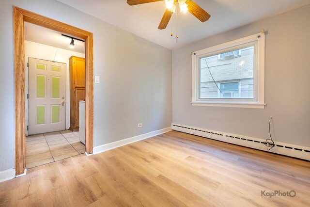 2051 E 72nd St Unit 1B, Chicago, IL 60649 - kitchen with gas stove, track lighting, open shelves, light tile patterned flooring, and brown cabinets