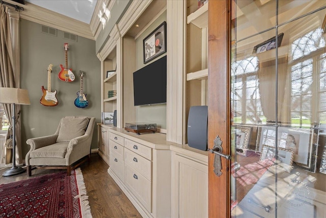 36W442 Hunters Gate Rd, Saint Charles, IL 60175 - sitting room with dark wood finished floors, crown molding, and built in features