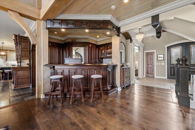 36W442 Hunters Gate Rd, Saint Charles, IL 60175 - indoor dry bar featuring baseboards, ornamental molding, wood finished floors, decorative light fixtures, and beam ceiling