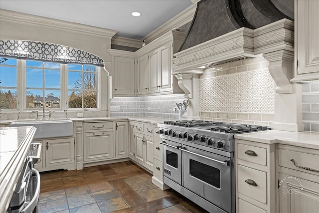 36W442 Hunters Gate Rd, Saint Charles, IL 60175 - kitchen with range with two ovens, a sink, tasteful backsplash, recessed lighting, and white cabinets