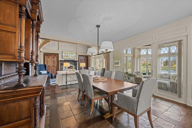36W442 Hunters Gate Rd, Saint Charles, IL 60175 - dining space with plenty of natural light, arched walkways, crown molding, and stone tile flooring