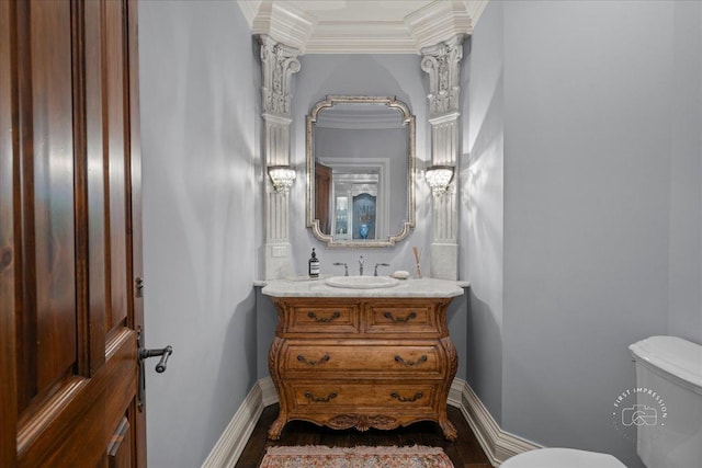 36W442 Hunters Gate Rd, Saint Charles, IL 60175 - half bathroom featuring toilet, vanity, crown molding, and baseboards
