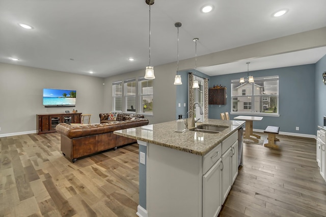34 Commons Cir, Hawthorn Woods, IL 60047 - kitchen featuring white cabinetry, baseboards, a sink, and light wood-style floors