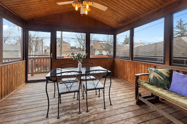sunroom / solarium with ceiling fan, outdoor dining space, and a wealth of natural light