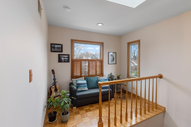 sitting room featuring a skylight