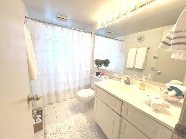 full bathroom featuring toilet, a shower with shower curtain, tile patterned flooring, and vanity