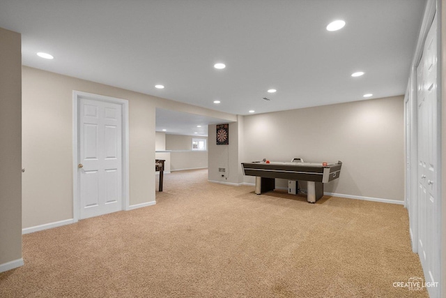 rec room featuring light colored carpet, recessed lighting, and baseboards