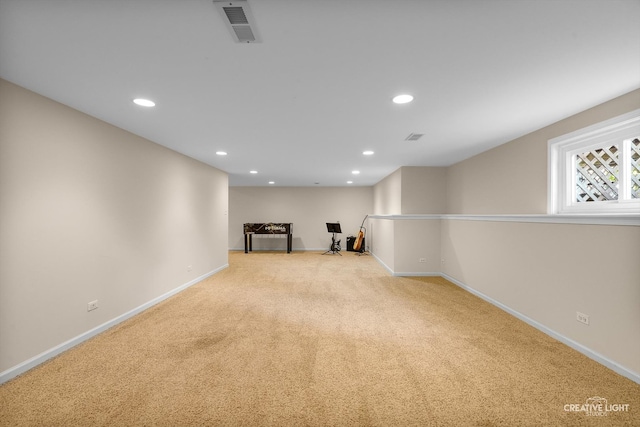 below grade area with baseboards, carpet flooring, and recessed lighting