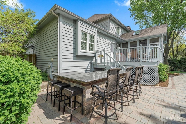 rear view of house featuring a patio