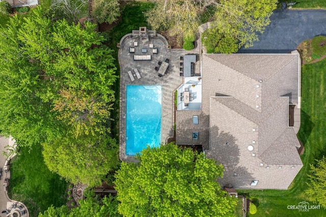 view of subject property featuring a pool