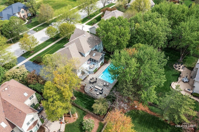 aerial perspective of suburban area with a pool area