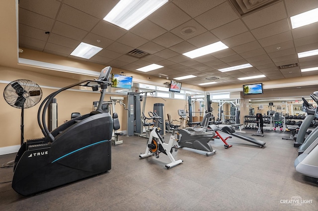 workout area featuring a drop ceiling
