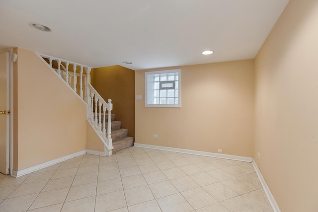 interior space featuring light tile patterned floors, baseboards, recessed lighting, and stairway