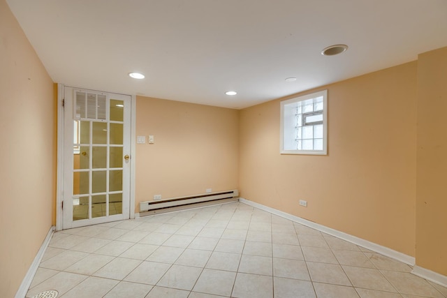 spare room featuring recessed lighting, baseboards, and baseboard heating
