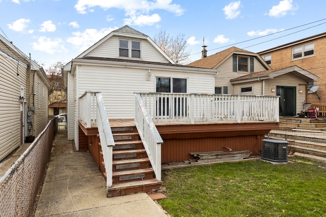 back of house featuring a lawn, central AC, stairs, and a deck