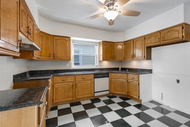 kitchen with dark countertops, dishwasher, dark floors, and ceiling fan