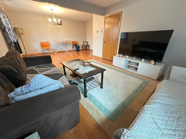6520 W Gunnison St, Harwood Heights, IL 60706 - living area featuring baseboards, an inviting chandelier, and wood finished floors