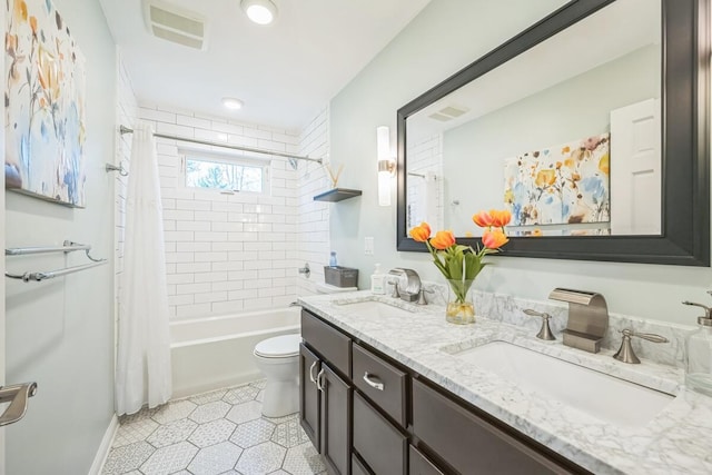 bathroom with tile patterned flooring, visible vents, a sink, and toilet