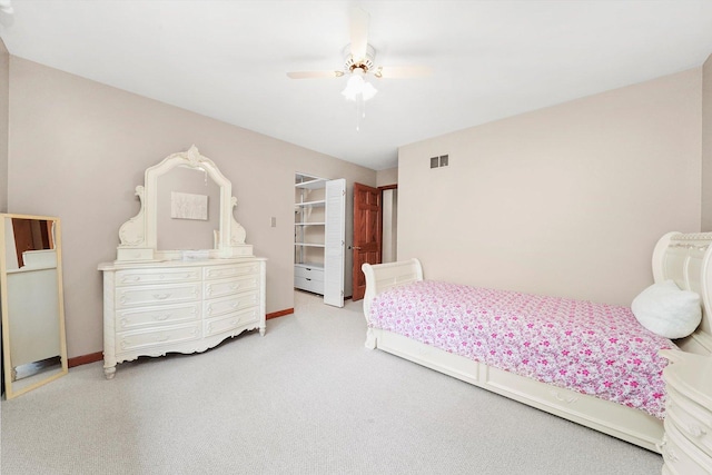 bedroom with carpet floors, ceiling fan, and baseboards