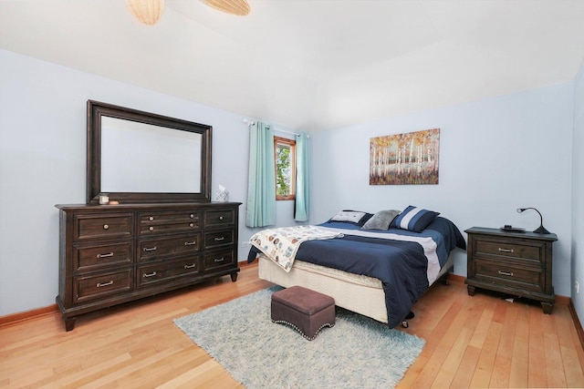 bedroom featuring light wood-style flooring and baseboards
