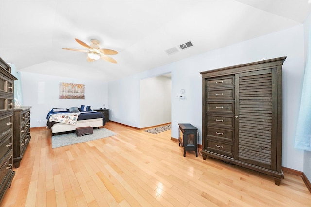 bedroom featuring light wood-style floors and baseboards