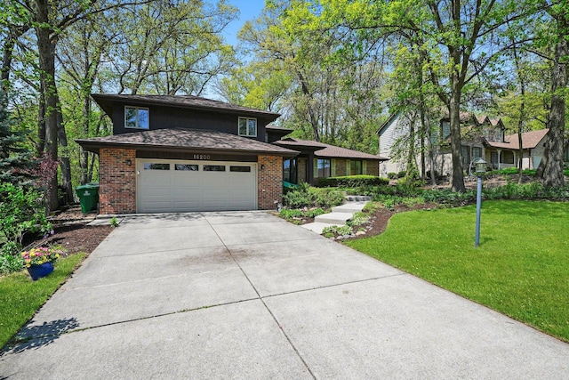 view of front of house with brick siding, concrete driveway, a front yard, an attached garage, and roof with shingles