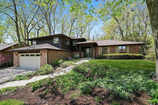 view of front of home with brick siding, driveway, and a front lawn