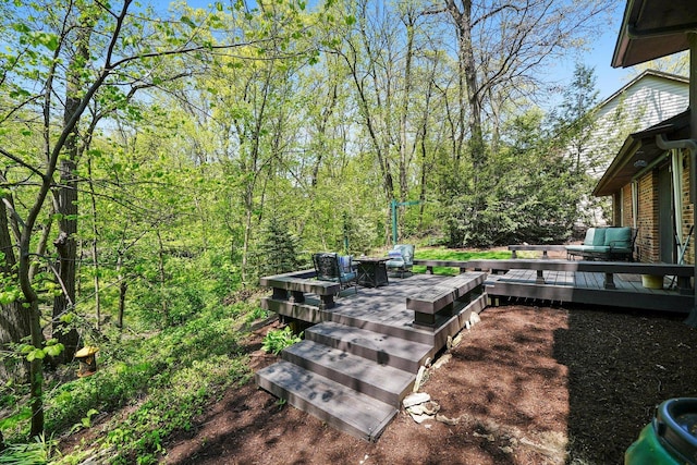 view of yard featuring a wooden deck
