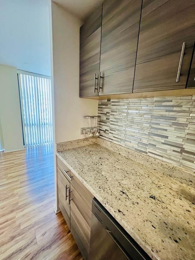 345 W Fullerton Pkwy Unit 503, Chicago, IL 60614 - kitchen with decorative backsplash, light wood finished floors, light stone countertops, and stainless steel dishwasher