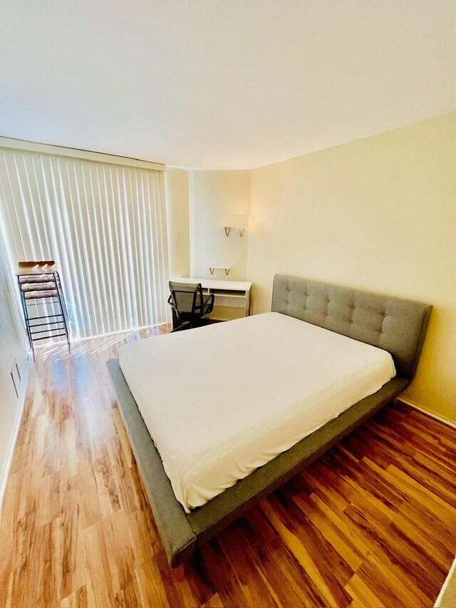 345 W Fullerton Pkwy Unit 503, Chicago, IL 60614 - bedroom featuring wood finished floors and baseboards