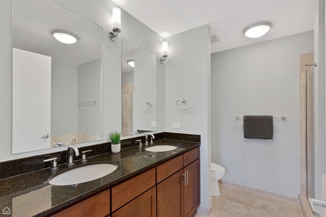 3920 N Sheridan Rd Unit 304, Chicago, IL 60613 - bathroom featuring a sink, visible vents, toilet, and a shower stall