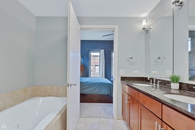 3920 N Sheridan Rd Unit 304, Chicago, IL 60613 - bathroom with a sink, double vanity, connected bathroom, and a garden tub