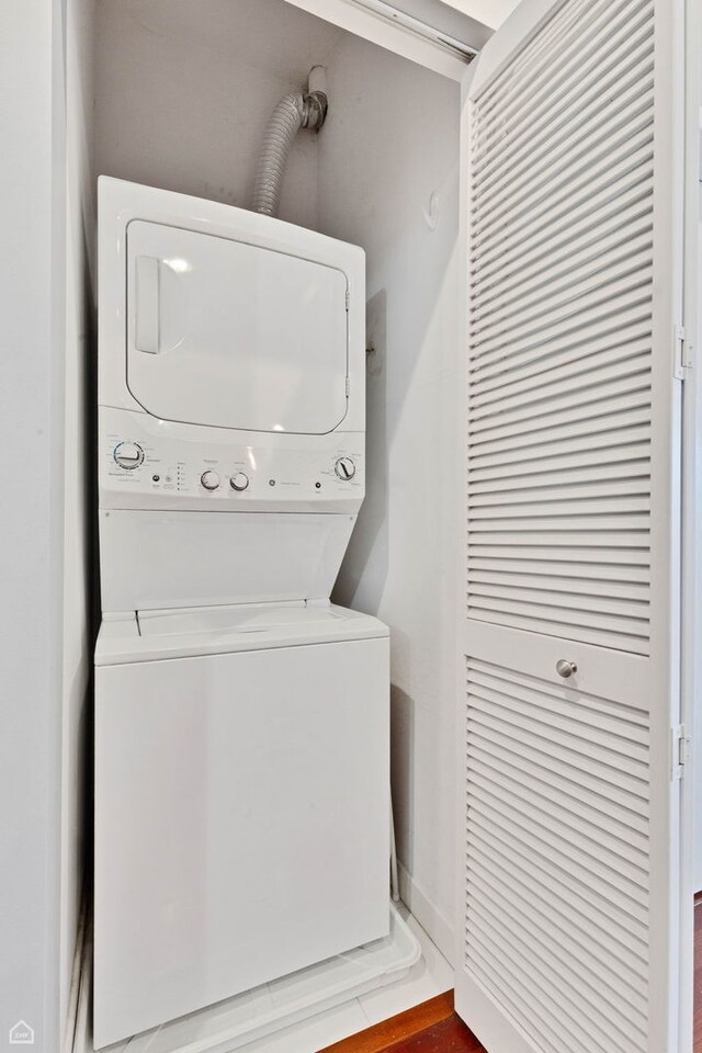 3920 N Sheridan Rd Unit 304, Chicago, IL 60613 - washroom with laundry area and stacked washer and clothes dryer