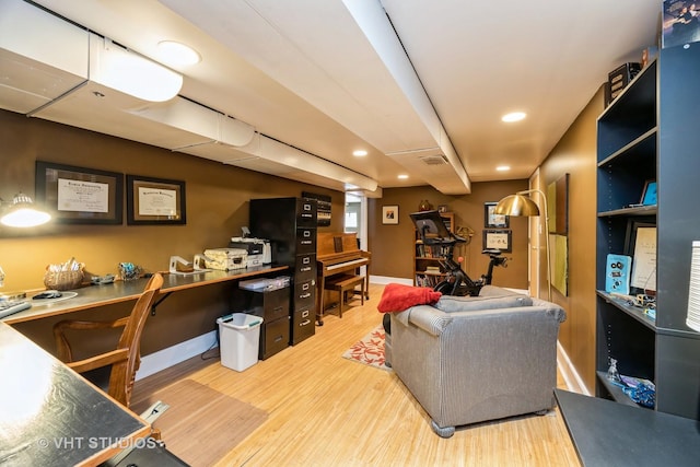 living room featuring recessed lighting, wood finished floors, visible vents, and baseboards