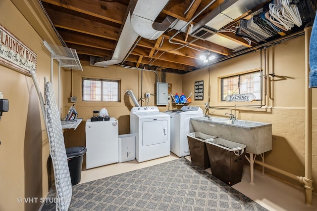 laundry area with visible vents, electric panel, laundry area, and washer and clothes dryer
