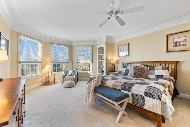 bedroom with ornamental molding, baseboards, and carpet