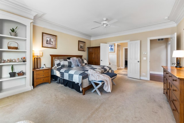 bedroom featuring crown molding, ceiling fan, visible vents, light carpet, and baseboards