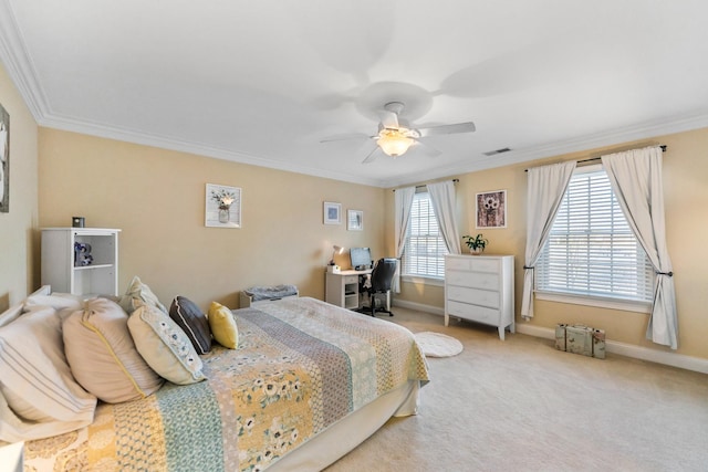 carpeted bedroom with visible vents, baseboards, crown molding, and a ceiling fan