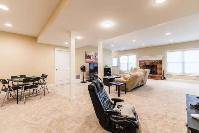living area with recessed lighting, baseboards, a brick fireplace, and carpet floors