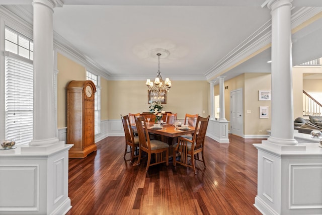 dining room with decorative columns, ornamental molding, and a wealth of natural light